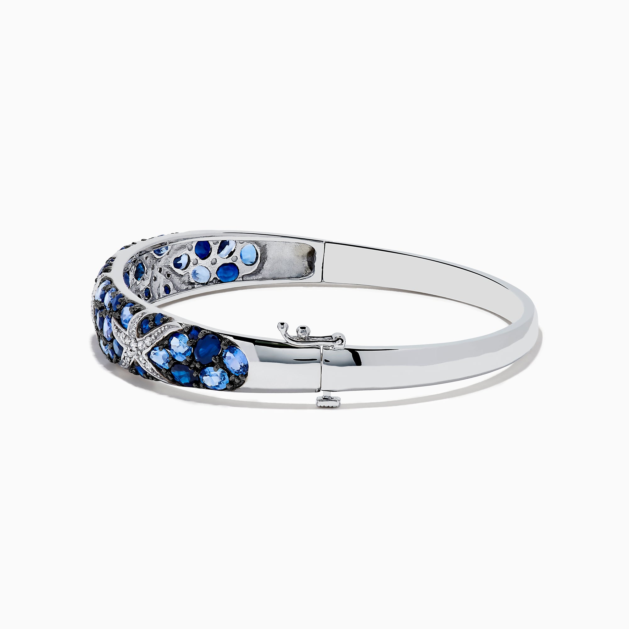 The Seaside 14K White Gold Sapphire & Diamond Starfish Bangle, 8.25 TCW, features blue sapphires and white diamonds in a crisscross pattern for an elegant seaside-inspired look.