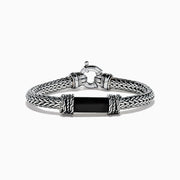 The Men's 925 Sterling Silver Braided Chain Onyx Bracelet 5.0 TCW features a braided silver band with a rectangular black onyx centerpiece, decorative metal accents, and a round clasp, shown on a white background.