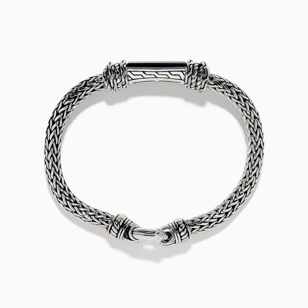 The Men's 925 Sterling Silver Braided Chain Onyx Bracelet 5.0 TCW features a braided silver band with a rectangular black onyx centerpiece, decorative metal accents, and a round clasp, shown on a white background.