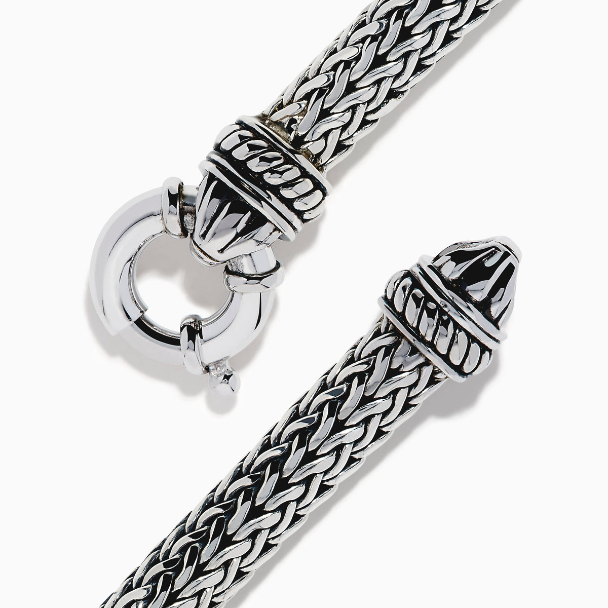 The Men's 925 Sterling Silver Braided Chain Onyx Bracelet 5.0 TCW features a braided silver band with a rectangular black onyx centerpiece, decorative metal accents, and a round clasp, shown on a white background.