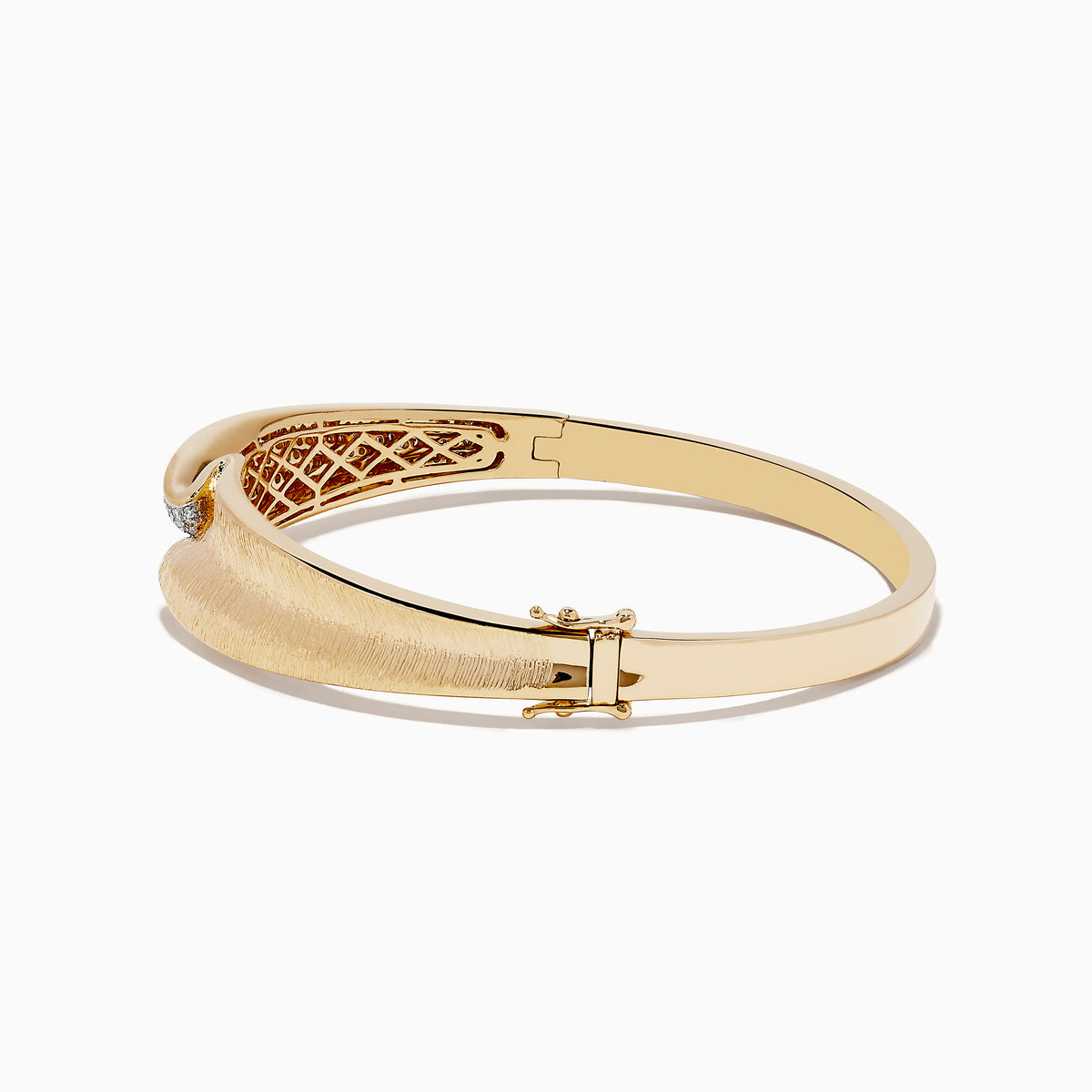 The DOro 14k Yellow Gold Pave Diamond Bangle showcases a unique design with one side encrusted in pave diamonds and the other in brushed gold, meeting at the center in a smooth, curved overlap.