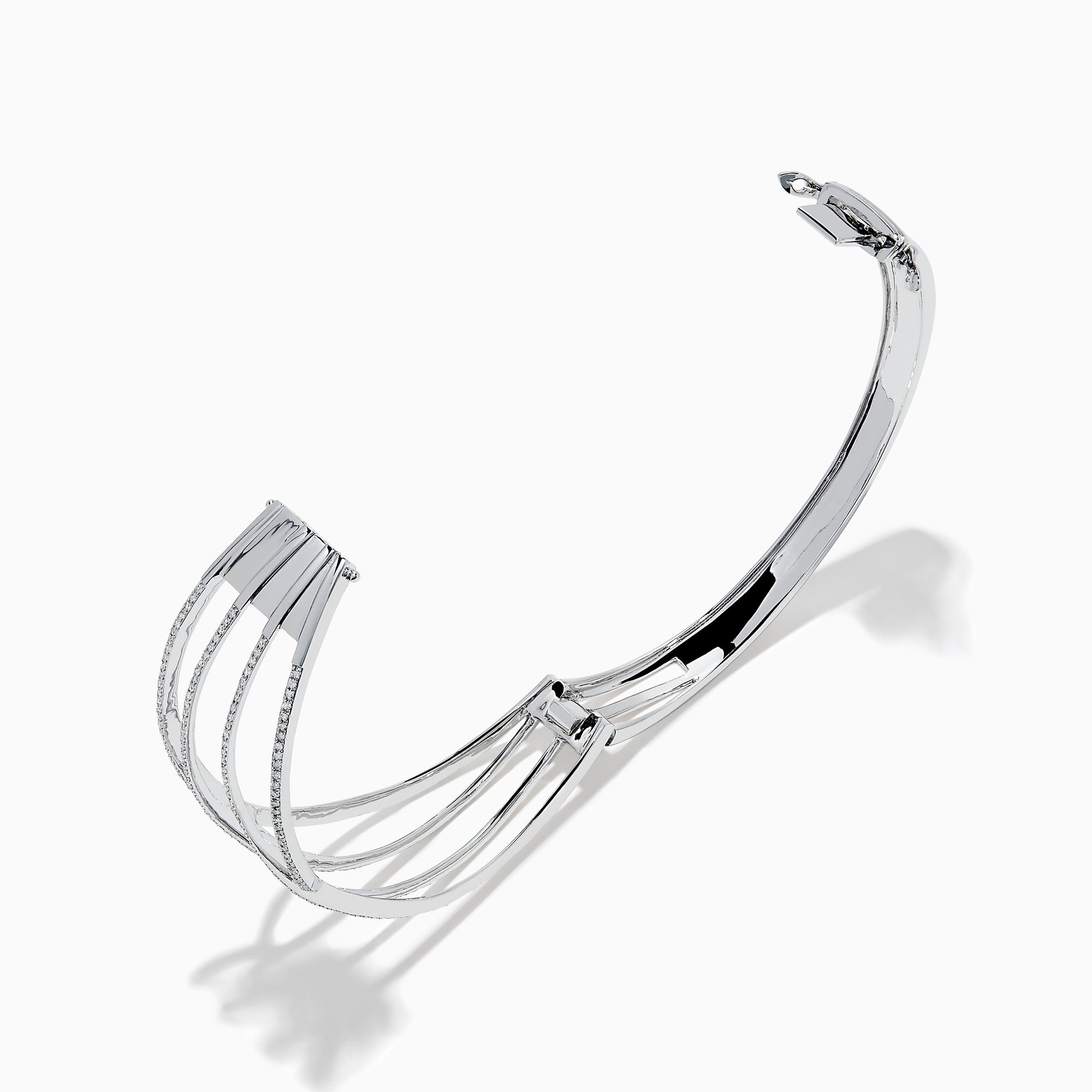 The 14K White Gold Pave Diamond Crisscross Bangle features an open, wavy design adorned with sparkling diamonds along the curves for an elegant, delicate look.