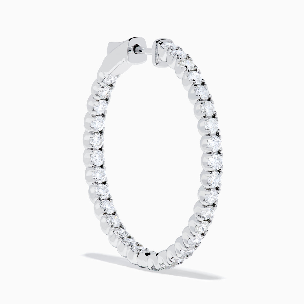 The 14K White Gold Inside Out Diamond Hoop Earrings (2.00 TCW) are shown vertically on a plain white background, with their shadows cast to the side.