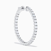 The 14K White Gold Inside Out Diamond Hoop Earrings (2.00 TCW) are shown vertically on a plain white background, with their shadows cast to the side.
