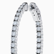 A pair of 14K white gold Inside Out Diamond Oval Earrings, 2.00 TCW, featuring sparkling diamonds, displayed against a plain white background.
