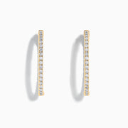 A pair of 14K Yellow Gold Inside Out Diamond Oval Earrings, 2.00 TCW, featuring small round diamonds and displayed against a plain white background.
