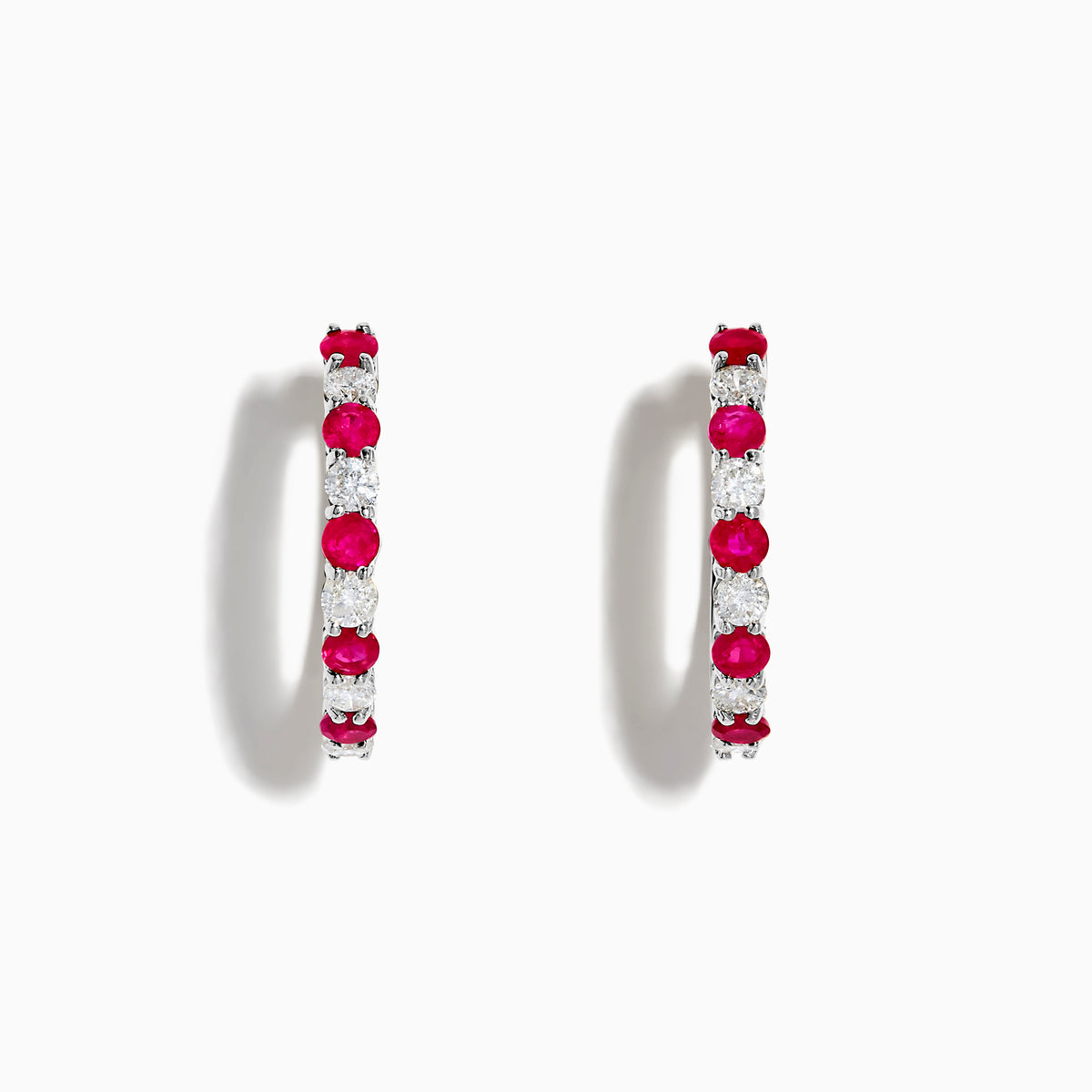 The 14K White Gold Ruby & Diamond Hoop Earrings, 1.35 TCW, feature alternating round red rubies and clear diamonds set in gleaming white gold, shown against a white background.