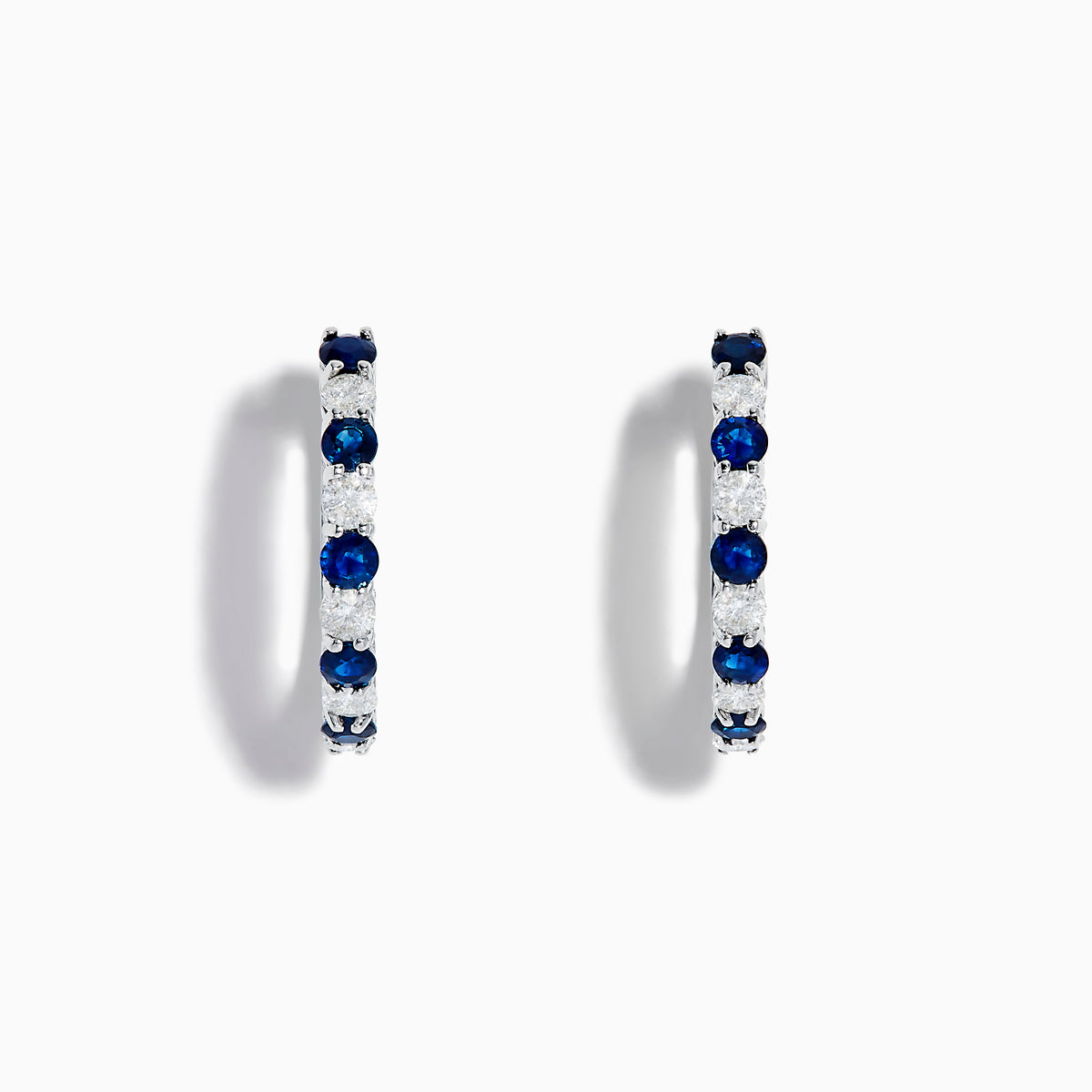 14K White Gold Blue Sapphire & Diamond Hoop Earrings, 1.35 TCW, featuring alternating sapphires and diamonds in a classic hoop design, shown against a white background with soft shadows.