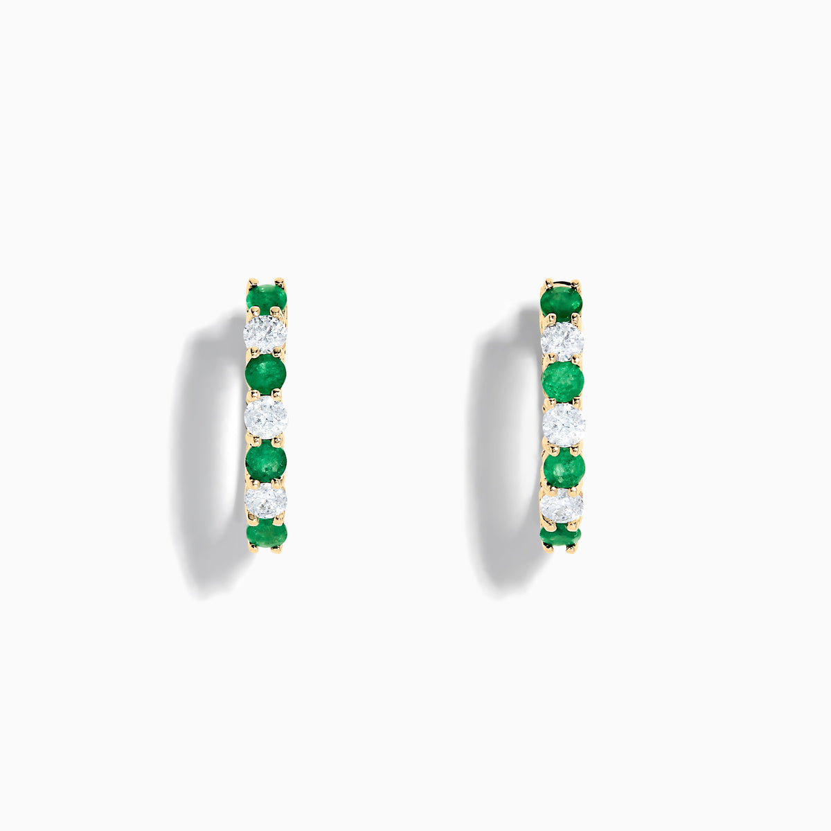 14K Yellow Gold Emerald & Diamond Hoop Earrings, 1.10 TCW, featuring alternating emerald and diamond stones, are shown on a white background with soft shadows.