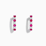 A pair of 14K White Gold Ruby & Diamond Hoop Earrings, 1.10 TCW, featuring alternating round red rubies and clear diamonds, displayed on a white background with each earring casting a soft shadow.