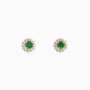 A pair of 14K Yellow Gold Emerald and Diamond Stud Earrings (0.72 TCW) with round emerald centers and a halo of diamonds, displayed on a white background.