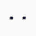 The Royale Bleu 14K White Gold Sapphire & Diamond Stud Earrings, 0.47 TCW, feature round dark blue sapphires encircled by a halo of diamonds, displayed against a plain white background.