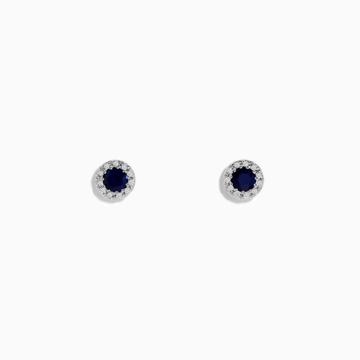 The Royale Bleu 14K White Gold Sapphire & Diamond Stud Earrings, 0.47 TCW, feature round dark blue sapphires encircled by a halo of diamonds, displayed against a plain white background.
