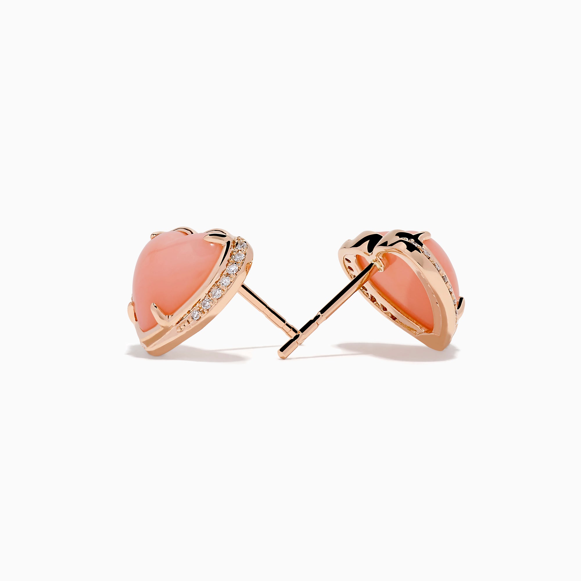 The 14K Rose Gold Pink Opal and Diamond Heart Stud Earrings feature pink heart-shaped centers accented with sparkling diamonds, shown on a white background.