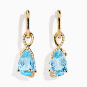Ocean Bleu 14K Yellow Gold Blue Topaz and Diamond Pear Dangle Earrings feature teardrop-shaped blue topaz gemstones accented with a curved line of sparkling diamonds.