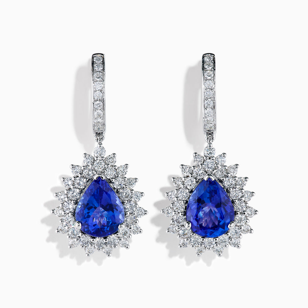 The Effy Hematian 18K White Gold Tanzanite and Diamond Halo Drop Earrings feature large teardrop-shaped blue tanzanites encircled by two rows of sparkling diamonds set in white gold.