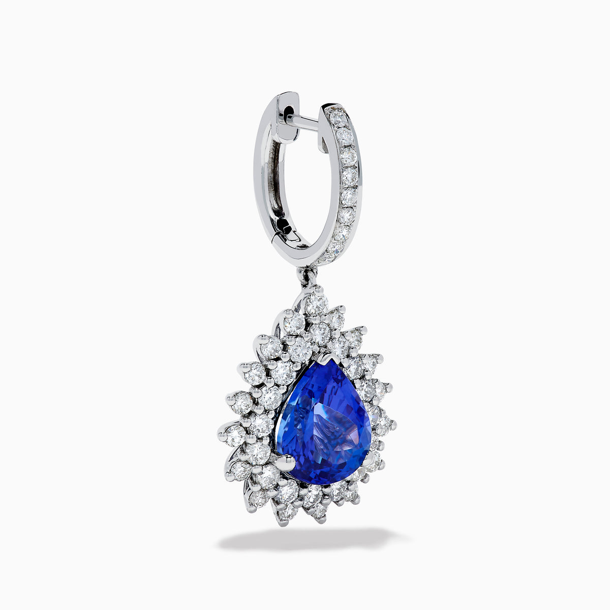 The Effy Hematian 18K White Gold Tanzanite and Diamond Halo Drop Earrings feature large teardrop-shaped blue tanzanites encircled by two rows of sparkling diamonds set in white gold.