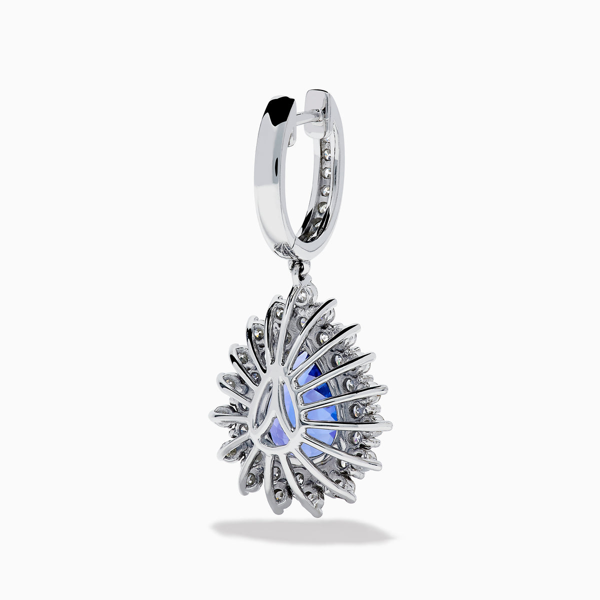 The Effy Hematian 18K White Gold Tanzanite and Diamond Halo Drop Earrings feature large teardrop-shaped blue tanzanites encircled by two rows of sparkling diamonds set in white gold.