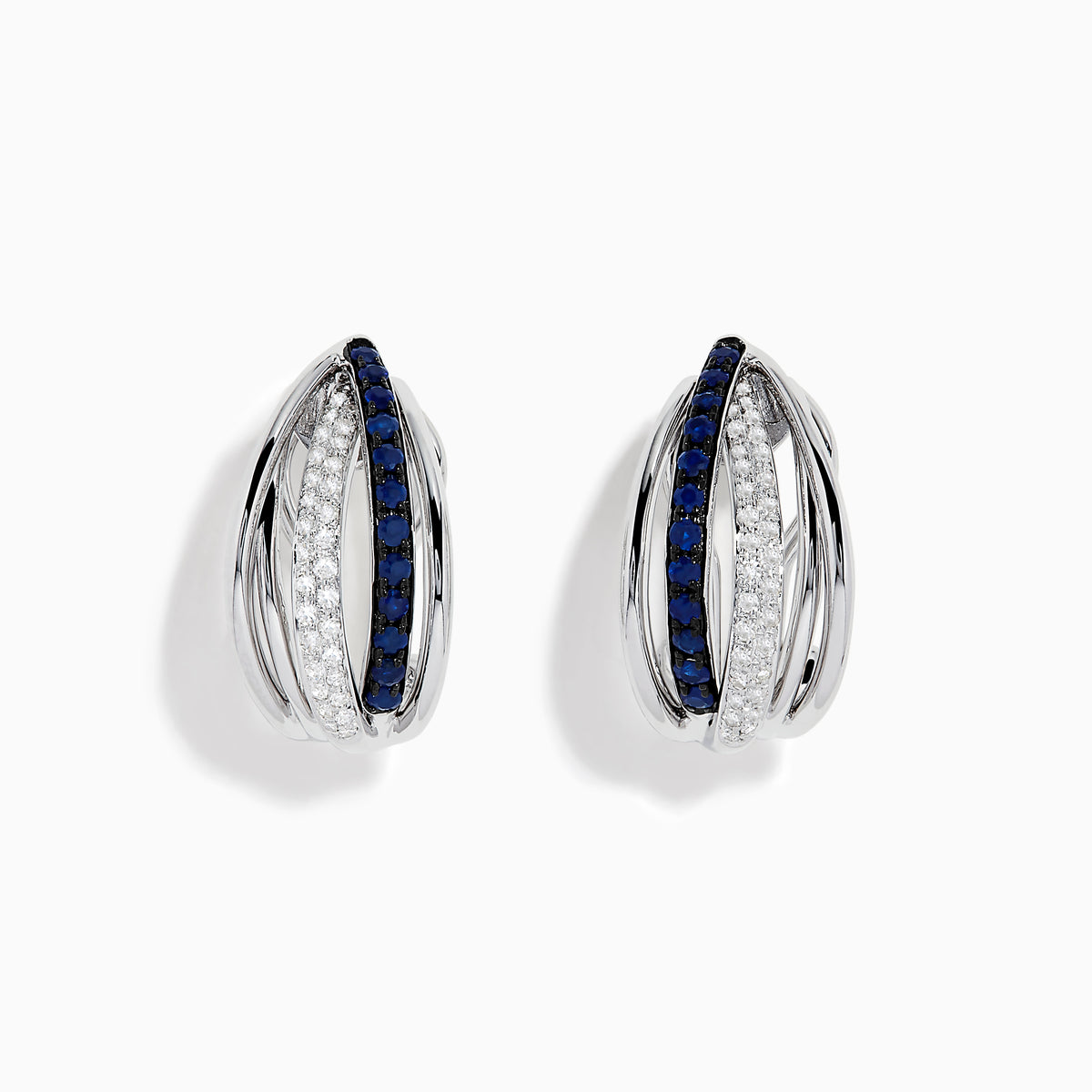 The Royale Bleu 14K White Gold Blue Sapphire & Diamond Earrings (0.62 TCW) feature intersecting bands—one adorned with white diamonds, the other with blue sapphires—shown on a white background.