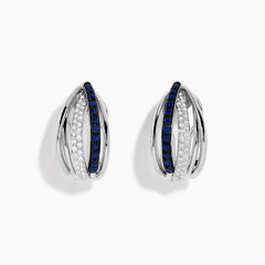 The Royale Bleu 14K White Gold Blue Sapphire & Diamond Earrings (0.62 TCW) feature intersecting bands—one adorned with white diamonds, the other with blue sapphires—shown on a white background.
