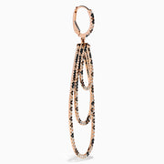 The 14K Rose Gold Espresso, Black, and White Diamond Cascading Teardrop Statement Earrings feature layered loops with alternating diamonds, recalling diamond teardrop elegance on a white background.