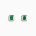 The 14K White Gold Emerald and Diamond Stud Earrings, 1.11 TCW, feature rectangular emeralds bordered by sparkling round diamonds, all set in white gold and shown on a plain white background.