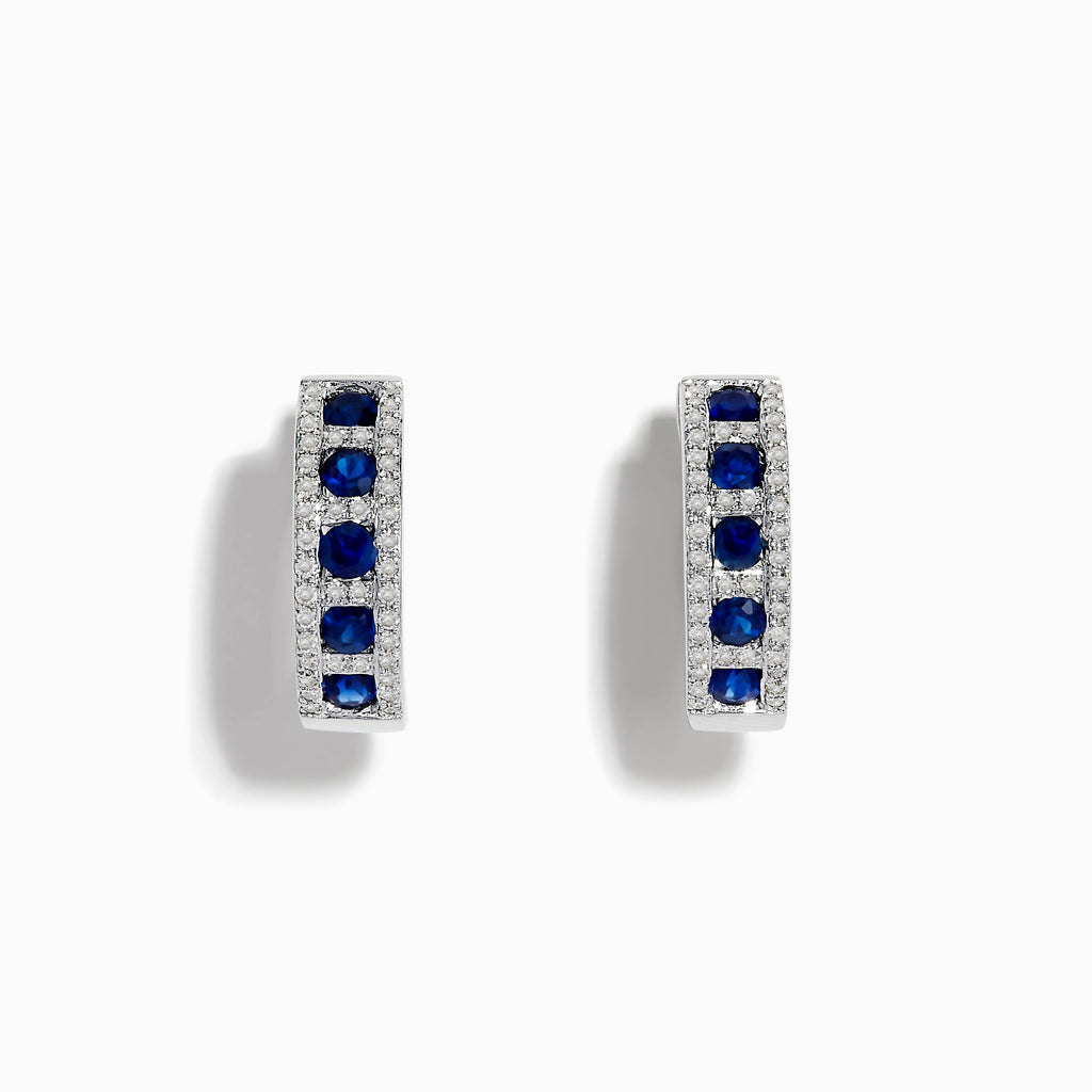 The Royale Bleu 14K White Gold Sapphire & Diamond Hoop Earrings, 1.03 TCW, showcase rows of sapphires bordered by diamond accents, elegantly displayed against a white background.