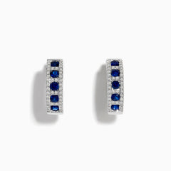 The Royale Bleu 14K White Gold Sapphire & Diamond Hoop Earrings, 1.03 TCW, showcase rows of sapphires bordered by diamond accents, elegantly displayed against a white background.