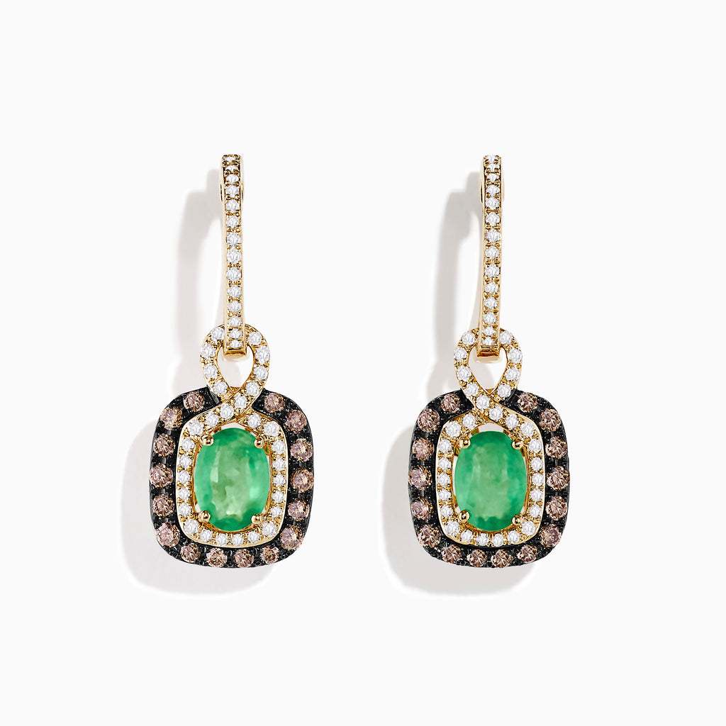 The 14k Yellow Gold Brown & White Diamond Halo Emerald Drop Earrings feature oval emeralds with brown and white diamond halos, plus diamonds on the hooks, shown against a white background.
