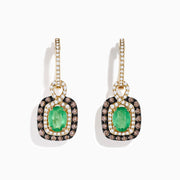 The 14k Yellow Gold Brown & White Diamond Halo Emerald Drop Earrings feature oval emeralds with brown and white diamond halos, plus diamonds on the hooks, shown against a white background.