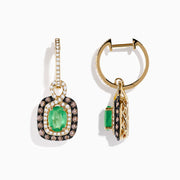 The 14k Yellow Gold Brown & White Diamond Halo Emerald Drop Earrings feature oval emeralds with brown and white diamond halos, plus diamonds on the hooks, shown against a white background.