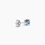 The 14K White Gold Blue Diamond Stud Earrings feature round blue diamonds set in white gold prongs, shown on a white background.