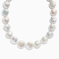 A close-up of the 14K Yellow Gold Freshwater Coin Shape Pearl Necklace, showcasing round, iridescent pearls in a partial semicircle on a white background.