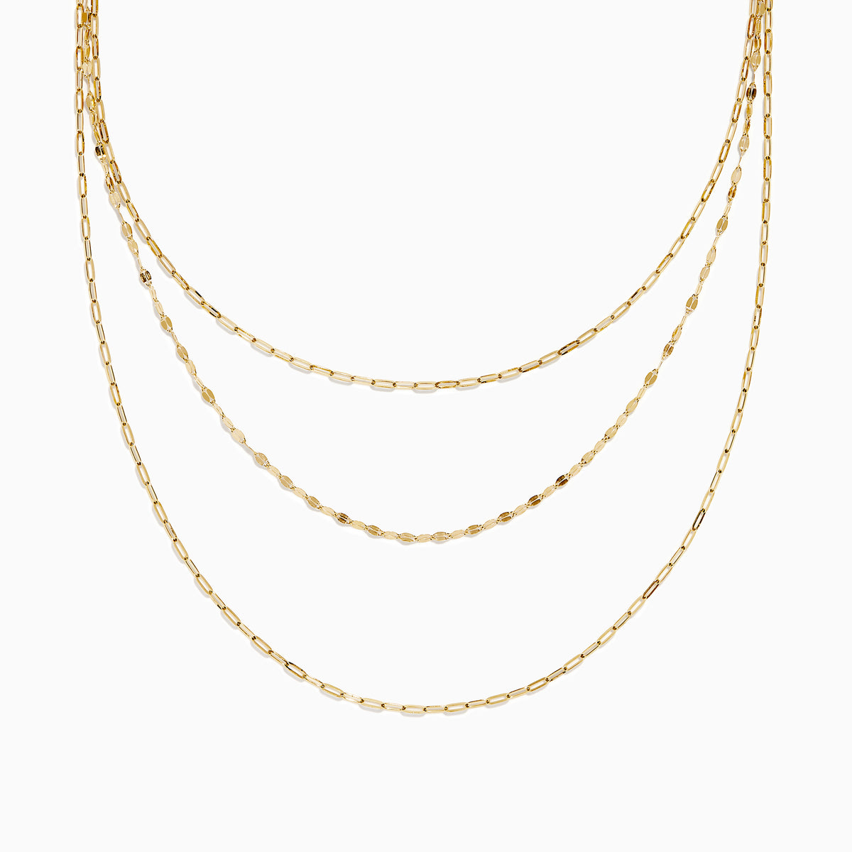 The 14K Yellow Gold Layered Chain Necklace features three delicate chains of different lengths with evenly spaced links, displayed on a white background—a perfect set for achieving effortless elegance.