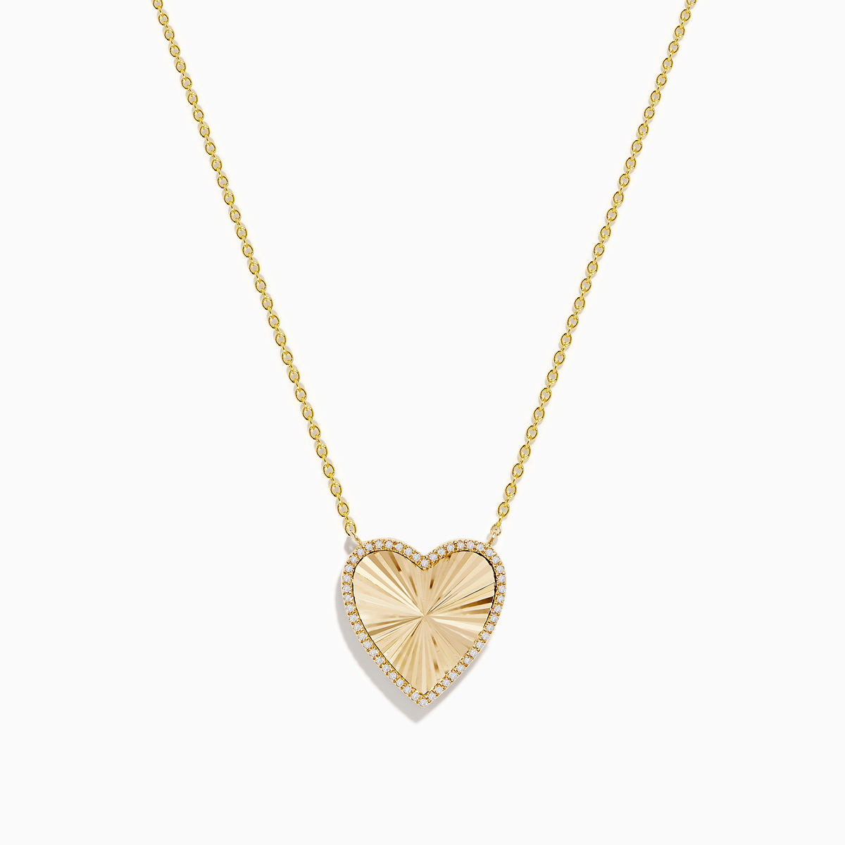 The 14K Gold Malachite and Diamond Reversible Heart Necklace showcases a large, heart-shaped malachite pendant with a smooth finish and delicate gold border.