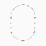 The 14K Yellow Gold Fresh Water Pearl and Mother of Pearl Necklace features alternating pearls and four-leaf clover-shaped mother-of-pearl charms, all evenly spaced along a delicate gold chain.