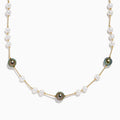 The 14K Yellow Gold Tahitian and Freshwater Pearl Necklace features alternating white and dark pearls on a delicate gold chain, beautifully displayed against a white background.