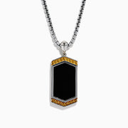 The Mens 925 Sterling Silver Onyx Pendant features a silver chain and a rectangular onyx pendant framed in silver, with a gold border and small gold studs accenting the top and bottom edges.