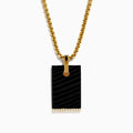 The Mens 14K Yellow Gold Diamond and Carved Onyx Pendant features a rectangular onyx with a gold attachment and a row of sparkling diamonds along the bottom edge, suspended from a gold chain necklace.