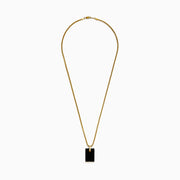 The Mens 14K Yellow Gold Diamond and Carved Onyx Pendant features a rectangular onyx with a gold attachment and a row of sparkling diamonds along the bottom edge, suspended from a gold chain necklace.