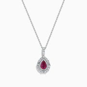 The 18K White Gold Pink Sapphire and Diamond Pendant features a teardrop-shaped pink sapphire surrounded by diamonds, with more diamonds on the bail, shown on a white background.