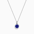 The Nahla Siri 14K Gold pendant showcases an octagon-cut tanzanite with a deep blue hue, surrounded by sparkling diamonds in a geometric setting.