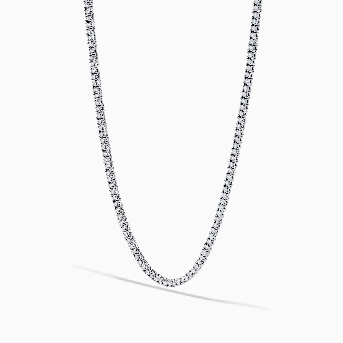 The 14K White Gold Diamond Tennis Necklace, 3.50 TCW features closely set round diamonds forming an elegant, continuous U-shaped chain, showcased gracefully against a plain white background.