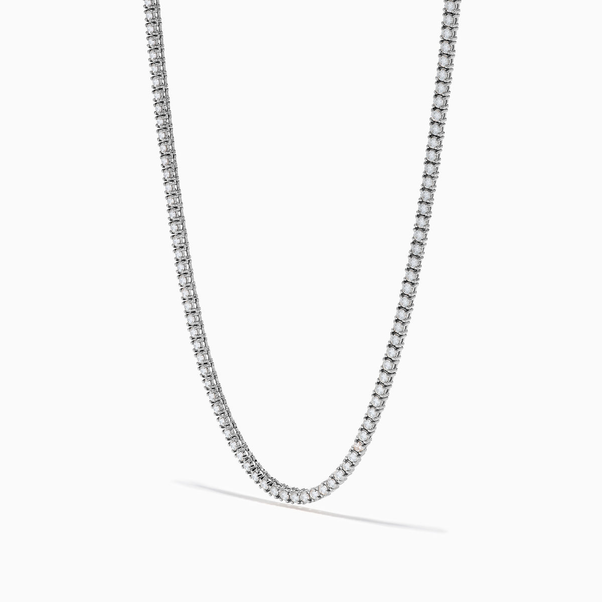 The 14K White Gold Diamond Tennis Necklace, 4.50 TCW, features a continuous row of sparkling white diamonds set in an elegant gold chain, displayed on a plain white background.