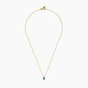 The 14K Yellow Gold Solitaire Round Emerald Pendant (0.48 TCW) features a delicate gold chain and a small round emerald, showcased against a white background.