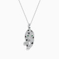The Signature 14K White Gold Diamond & Emerald Pendant (0.79 TCW) showcases a leopard-shaped design with black spots, green emerald eyes, and diamond accents, elegantly hanging from a delicate chain.