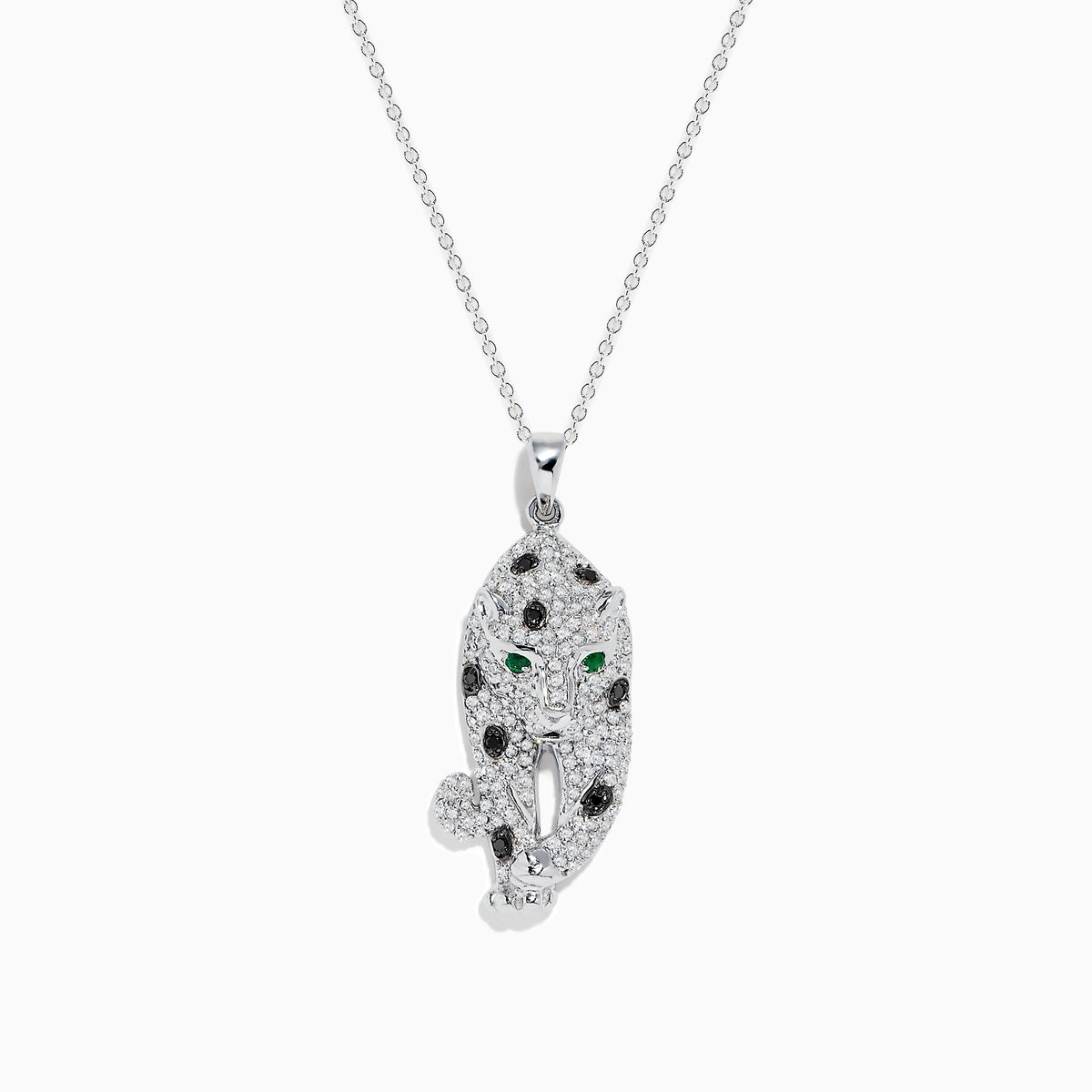 The Signature 14K White Gold Diamond & Emerald Pendant (0.79 TCW) showcases a leopard-shaped design with black spots, green emerald eyes, and diamond accents, elegantly hanging from a delicate chain.