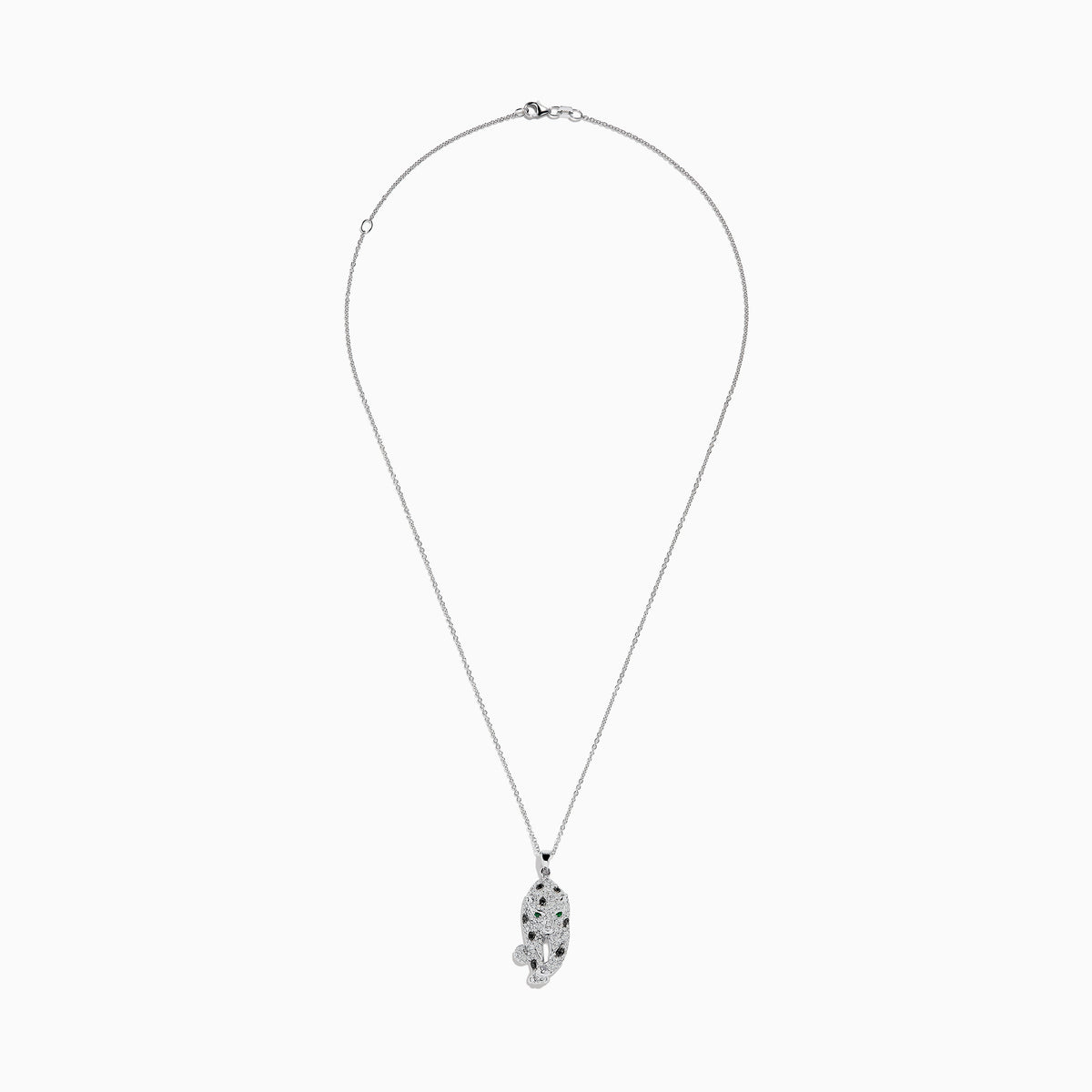 The Signature 14K White Gold Diamond & Emerald Pendant (0.79 TCW) showcases a leopard-shaped design with black spots, green emerald eyes, and diamond accents, elegantly hanging from a delicate chain.
