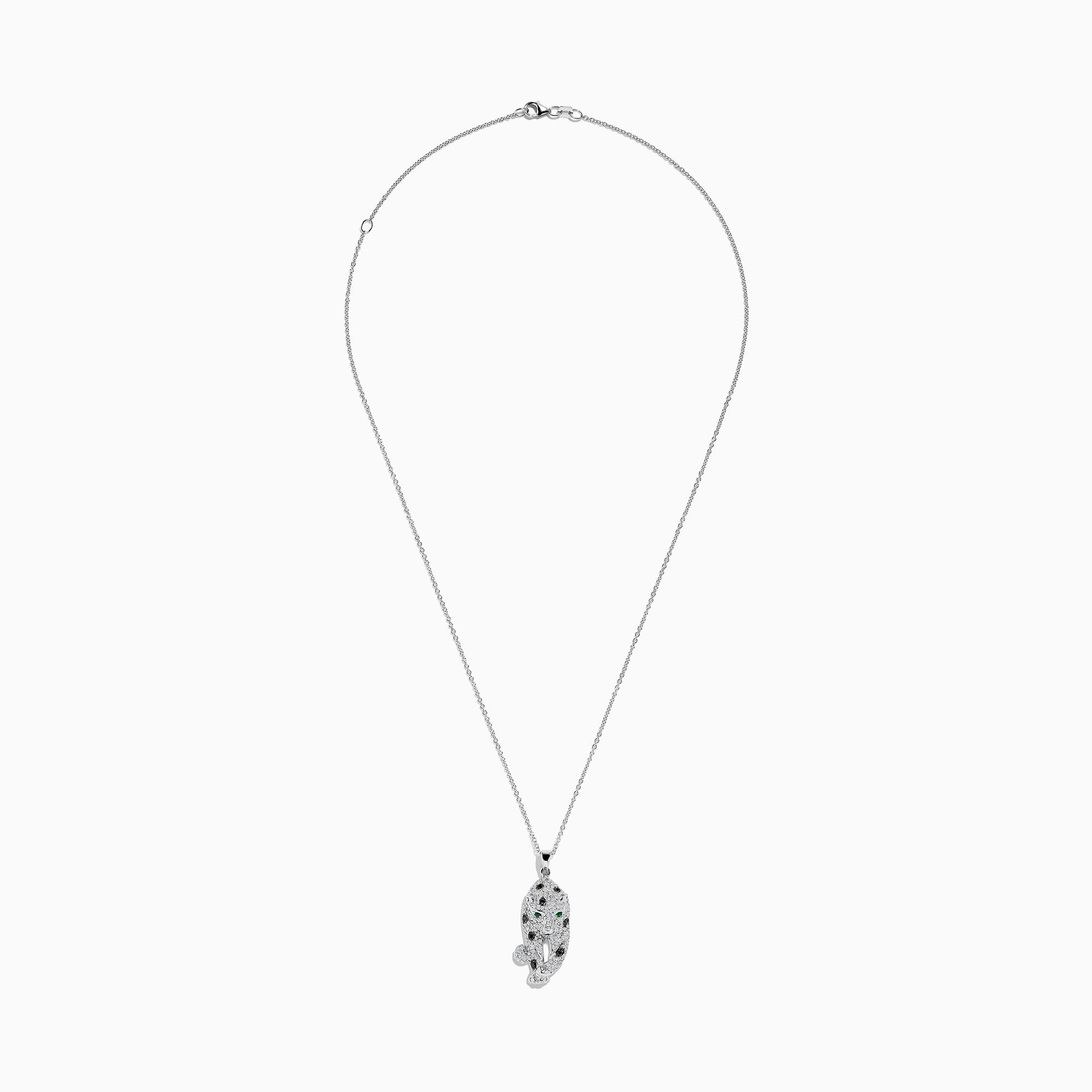 The Signature 14K White Gold Diamond & Emerald Pendant (0.79 TCW) showcases a leopard-shaped design with black spots, green emerald eyes, and diamond accents, elegantly hanging from a delicate chain.