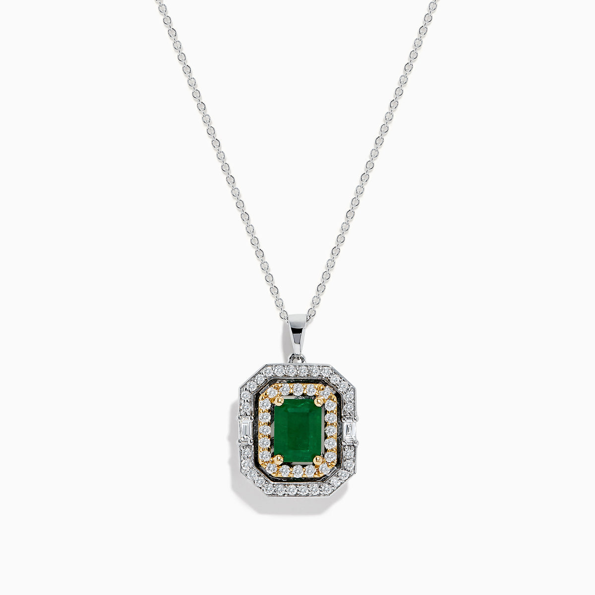 The Brasilica 14K Two Tone Gold Emerald and Diamond Pendant features a rectangular emerald at the center, surrounded by sparkling white and gold diamonds for a total carat weight of 2.09.